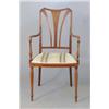 Image 1 : An Edwardian inlaid mahogany elbow chair on tapered legs....