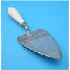 Image 1 : A Victorian silver trowel, with ivory handle and scroll engraved blade....