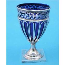 A plated urn with blue glass liner and square foot, 8.5ins....