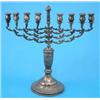 Image 1 : A George V silver menorah, with scroll engraved circular foot, 1934, 22oz....