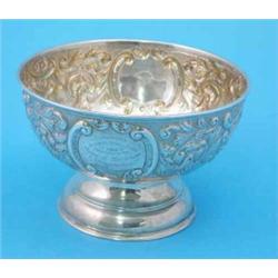 An Edwardian silver rose bowl, with repousse scroll decoration, Chester 1903...