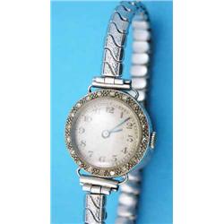 A lady's 18ct white gold cocktail watch, with diamond set bezel...