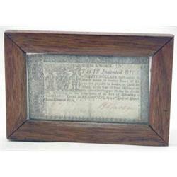 An 18th century American eight dollar note printed in Annapolis circa 1770 by A.C. and W. Green,...