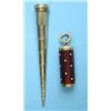 Image 1 : A gold cased telescopic pencil, with red guilloche and white dot enamelled outer case...