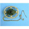 Image 1 : A gold mounted scarab brooch, the scarab in open border of split pearls...