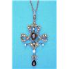 Image 1 : An Edwardian 15ct gold openwork pendant, set amethysts and seed pearls, on trace link chain...