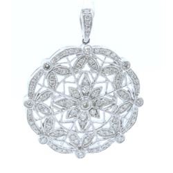 18K WHITE GOLD DIAMOND PENDANT:6.13 GRAMS/DIAMOND:0.69CT