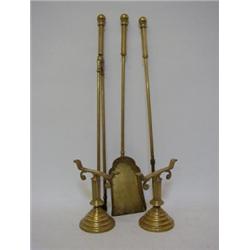 A SET OF VICTORIAN BRASS FIRE IRONS, with stands, lozenge marks (5) 30-50...