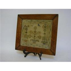 A CHILD'S SAMPLER, 19th Century, unsigned or dated, strawberry border framing floral and bird sub...