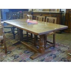 ROBERT 'MOUSEMAN' THOMPSON, a refectory dining table, quarter cut oak adzed top on faceted and co...