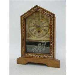 AN OAK MANTEL TIMEPIECE, late 19th Century, painted arch case, Roman dial, Wuttemberg paper label...