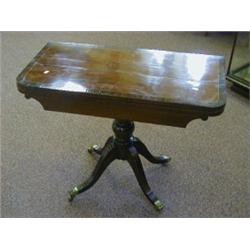A MAHOGANY GAMES TABLE, 19th Century, fold-out rectangular top, crossbanded and strung, bulbous p...