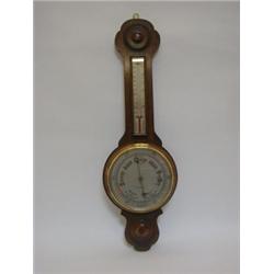 AN ANEROID BAROMETER, 20cm silvered dial below a thermometer, oak case, c1930, height 78cm  30-50...