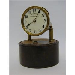 A 'EUREKA 1,000 DAY ELECTRIC CLOCK', Patent 14614, 1906, No.2880, on a circular wooden plinth, he...