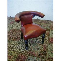 A LIBRARY READING CHAIR, c.1830, mahogany upholstered eliptical arm rest, serpentine front rail,...