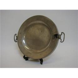 A PEWTER HOT PLATE, twin handles, London touchmarks, diameter 24cm 30-40...