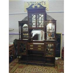 AN EDWARDIAN MAHOGANY CHIFFONIER, swan neck pediment, geometric astragal glazed doors, mirror ins...