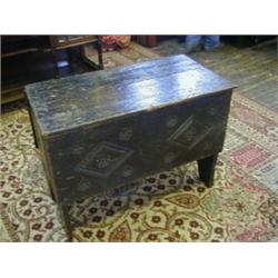 AN OAK CHEST, of simple butted and nailed construction, carved lozenge and rosette front panel, d...