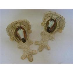 A PAIR OF STAFFORDSHIRE WALL BRACKETS, late 19th Century, formed as coloured horse's heads protru...