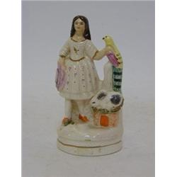 A CHIMNEY FIGURE, 20th Century, girl with parrot and rabbit, height 13cm 20-30...