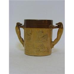 A SALT GLAZED STONEWARE LOVING CUP, 19th Century, greyhound handles, sprigged hunting subject, he...