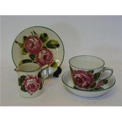 A WEMYSS WARE CUP AND SAUCER, a cream jug (s.d.) and single saucer, briar rose design, script mar...