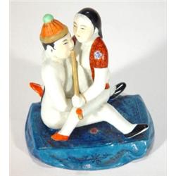 Oriental erotic porcelain figure of lady an…