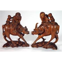 Pair of Oriental hardwood figures carved wi…
