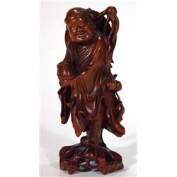 Carved Oriental hardwood figure in robes cl…