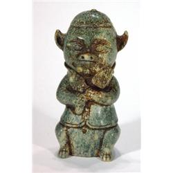 Carved Oriental green marble pig in a jacke…