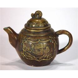 Miniature bronze teapot, cast with panels o…