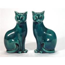 Pair of turquoise glazed seated Poole potte…