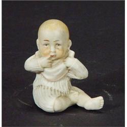 Hand painted seated bisque baby, 4cm high…