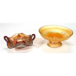 Two handled purple and orange carnival glas…