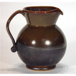 Brown and black glazed Rye pottery jug, mar…