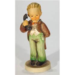 Hand painted Hummel boy clutching a telepho…