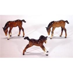 Three hand painted brown Beswick foals, mar…