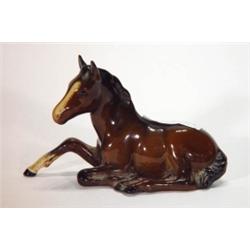 Hand painted Beswick seated foal, impressed…