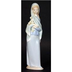 Hand painted Lladro figurine clutching lili…
