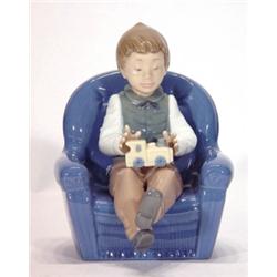 Hand painted Nao seated child playing with …