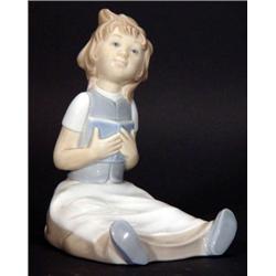 Hand painted Nao seated girl reading a book…