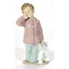 Image 1 : Hand painted Nao porcelain boy clutching a …