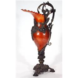 Spelter and metal ewer, ornately cast with …