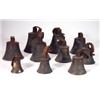 Image 1 : Nine bronze hand bells with leather straps,…