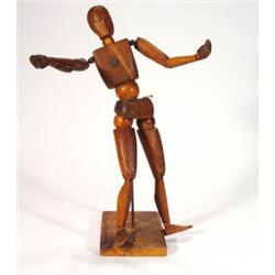 Adjustable pine artist's mannequin with joi…