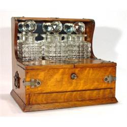 Brass mounted oak three bottled tantalus, t…