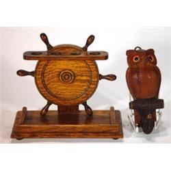 Oak ship's wheel piperack and a carved wood…