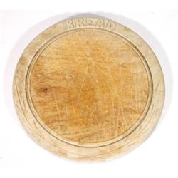 Circular carved beech breadboard, 26cm diam…