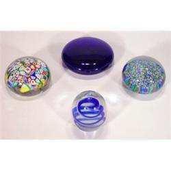 Four glass paperweights including two with …