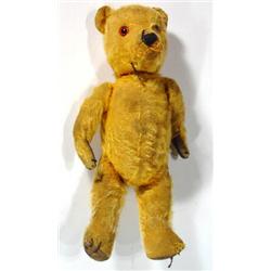 Straw filled jointed teddy bear with golden…